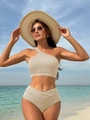 Beige ribbed one-shoulder bikini set with high-waisted bottoms on beach background - S / Off White