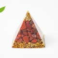 Pyramid resin craft with natural red crystal stones and golden foil chips on white background - 3cm / Red Jasper