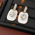 Macro detail of vintage gold oval stud earrings with clear crystals in a black gift box - 48# Silver Pin Enamel Rhinestone Oval
