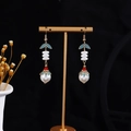 Detail of hanging butterfly pearl tassel earrings with blue enamel leaves on gold stand - E3044-5 (Gold/Pearl/Cyan Enamel/Red Bead)