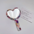Portable heart-shaped hand mirror featuring a colorful floral acetate patterned frame - Multi - Heart Terrazzo Pattern