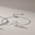 Elegant sterling silver couple bracelet featuring a minimalist heart knot charm design - Concentric Knot Bracelet Women