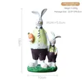 Figura decorativa de conejo padre e hijo en resina con zanahoria, altura 18 cm - Conejo Padre e Hijo