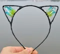 Cat ear headband featuring gradient blue and green crystal clusters in a hand-held view - No.20 Blue-Green Gradient