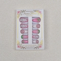 Macro detail of 3D strawberry embossment and cherry patterns on 24pcs press-on nails - Dragon Fruit Cherry Strawberry Embossed Pink French Style (WY-019)