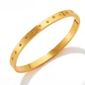 Gold plated stainless steel cuff bracelet with star patterns and zircon inlays - Star Engraved Rhinestone Bangle (KAS839)