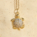 Ocean-inspired gold sea turtle necklace with sparkling pavé zircon stones on dainty O-chain - Sea Turtle