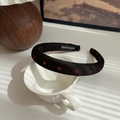 Sweet black headband with red heart patterns and handmade label on a ceramic cup - Black-Heart
