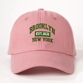 Detail of green Brooklyn New York embroidery on a pink cotton baseball cap fabric - One Size / Deep Pink