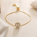 Close-up of 18K gold bracelet with mother of pearl Virgin Mary pendant and zircons - Virgin Mary Style (32019)