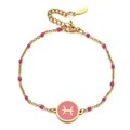 Detailed macro of golden stainless steel Pisces zodiac bracelet with magenta enamel - Stainless Steel / Pisces-Magenta