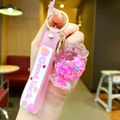 Pink candy oil-filled glowing keychain with beads, floral charms and wristband strap - Lollipop String [pink] Glow-in-the-dark Bubble Bead Candy