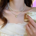 Double-layer pearl necklace featuring a heart pendant and delicate floral tassel style - White Heart
