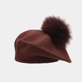 Detail of dark brown knitted beret featuring a fluffy pompom and vertical stitch texture - One Size / Brown