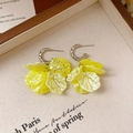 Detailed macro view of yellow resin petal earrings with silver C-shape metal ear hooks - 29# 925 Sterling Silver Earring Post - Yellow - Petal