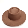 Close-up of a brown wool felt pork pie hat featuring a wide brim and detailed stitching - 57cm / Brown
