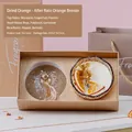 Orange and dried flower scented candle in amber glass jar with premium gold gift box - Dried Orange
