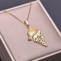 Detailed view of gold wolf head pendant necklace inside a luxury brushed jewelry box - Necklace / Gold