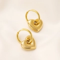 Close-up of polished gold heart earrings on elegant beige silk fabric texture - 18K Gold Heart (X094)
