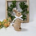 Detailed texture of rustic resin rabbit statue with a white ribbon bow for garden decor - Brown Standing Style