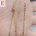 Detail of 18K gold plated cable chain featuring lobster clasp and extension links - Textured Flat Link Chain