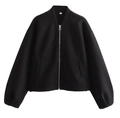 Close-up of a black bomber jacket with silver metal zipper and size S neck label - S / Black
