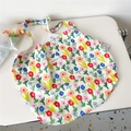 Detailed close-up of a floral oil painting canvas tote bag with a woven brand label - 7D Crayon Flowers