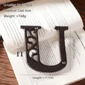 Industrial cast iron letter U wall decor with vintage brown finish and mounting screws - Letter U