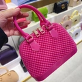 Bright pink PVC jelly shell bag with textured finish and golden zipper details - Rose Red
