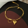 Elegante pulsera de acero de titanio dorado con colgante de corazón y detalle de borla fina - Corazón (E69) / Dorado
