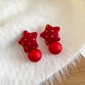 Detailed view of red polka dot star earrings with round beads on soft white faux fur - Matte Ball Drop / Silver Needle - Red - Matte