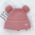 Pink knitted bear ear beanie for women with cute heart patch and warm earflaps - One Size / Pink