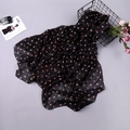 Elegant lightweight black chiffon scarf with orange polka dots in a floral setting - Orange Polka Dot on Black