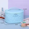 Light blue Y2K heart embossed makeup bag with dimensions 21x15.5x12.3cm and top handle - Oval / Blue