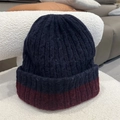 Detailed view of thick chunky knit texture on two-tone navy and red winter beanie hat - One Size / Navy Blue/Red Contrast
