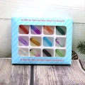 Twelve natural assorted crystal clusters set in a blue striped gift box with clear window - Hexagonal Column Set 1