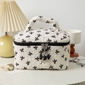White quilted makeup bag with black bow prints and elegant pearl zipper charm - Large / White Black