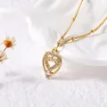 Gold heart pendant necklace with LOVE engraving and cubic zirconia on white background - A-Hollow Heart LOVE