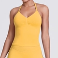 Detailed knit texture and halter V-neck design of this yellow seamless yoga sports bra - Yellow