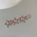 Macro shot of silver star hair clip with pink rhinestones and secure duckbill clasp - Three Stars / Pink