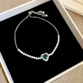 Macro detail of emerald heart pendant bracelet with adjustable pull chain and silver finish - 19# Silver Green Heart Slider Style