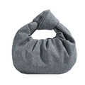 Grey textured denim hobo bag with unique knotted handle and minimalist slouchy crescent shape - Denim Grey