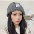 Classic grey chunky knit beanie with cuffed edge worn by a model in casual white hoodie - Cable Knit Grey