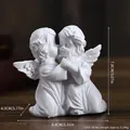 Miniature white resin praying angel sculpture decor depicting two hugging cherubs - Mini Embracing Angels