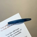 Glossy navy blue hair clip featuring golden French lettering on elegant paper - Premium Blue