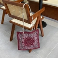 Deep burgundy tote bag featuring paisley bandana print and colorful beaded strap details - Small Crossbody Bag / Red Green Double-Sided Paisley