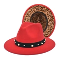 Detail of red fedora hat featuring a black band with pearls and leopard print lining - Red