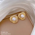 Macro view of gold pearl earrings with crystal bird nest spiral petals on satin - Pearl Micro Pave Stud Earrings (F454)
