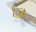 Textured gold rectangular stud earrings with geometric facets on a beige jewelry box - Rectangular Geometric Facet / Gold