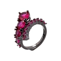 Detail view of black metal ring featuring claw-set red stones and oval gemstones - Gun Black Rose Red Zircon